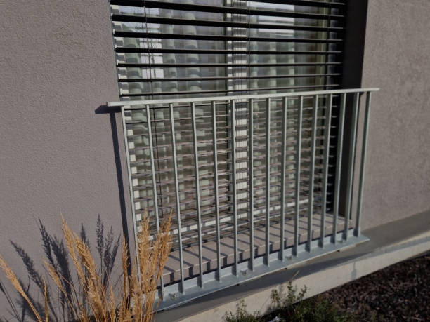 istock We installed prepared anchors from aluminum mobile scaffolding using stainless steel rails. railing is made of hardened, glued safety film and protects children from falling out when window open 2196146897