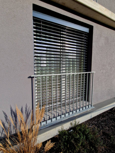 istock We installed prepared anchors from aluminum mobile scaffolding using stainless steel rails. railing is made of hardened, glued safety film and protects children from falling out when window open 2196146920