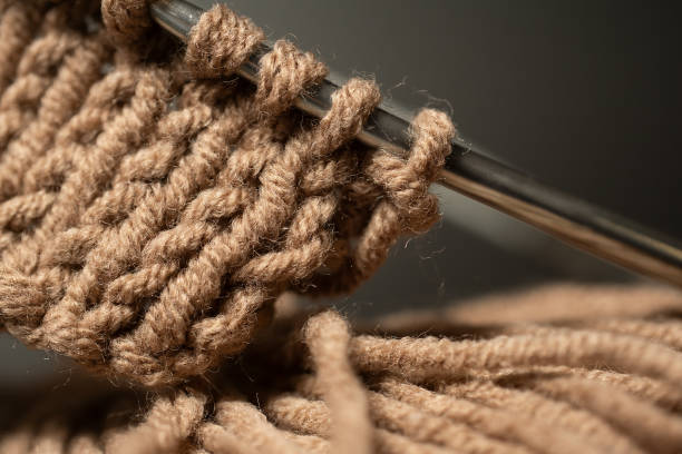 istock Close-up knitting on needles, warm yarn color, macro shot. 2196151296