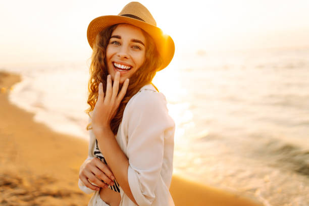 istock Young woman enjoys her vacation on the beach. 2196152687