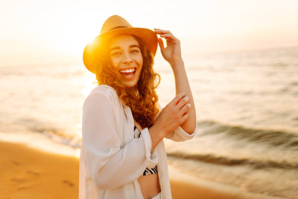 istock Young woman enjoys her vacation on the beach. 2196152688