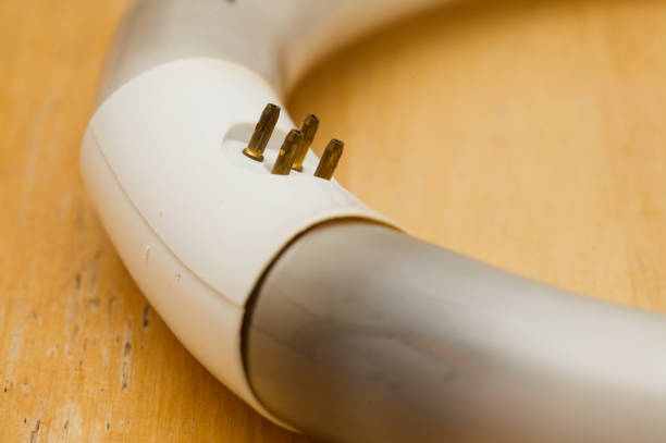 Circular fluorescent tube burned out and blackened at the cathodes, contact pad prongs oxidized