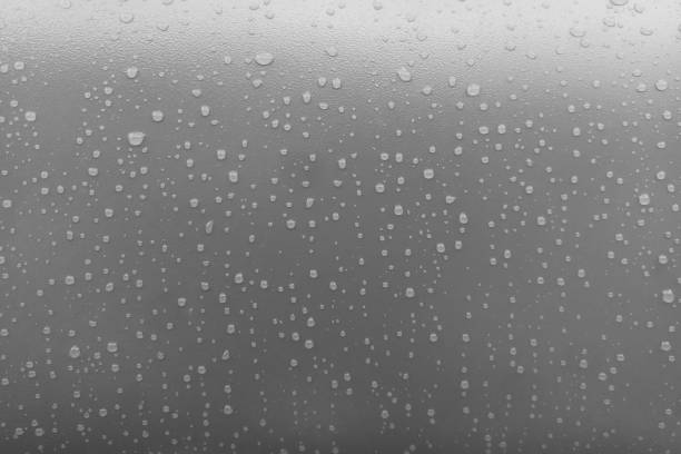 water drops on uniform gray metal paint background