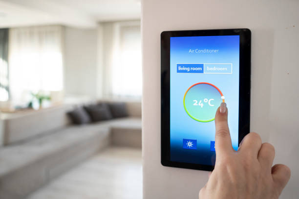 istock Wall-mounted screen shows temperature control for smart air conditioner in stylish living room. 2196154962