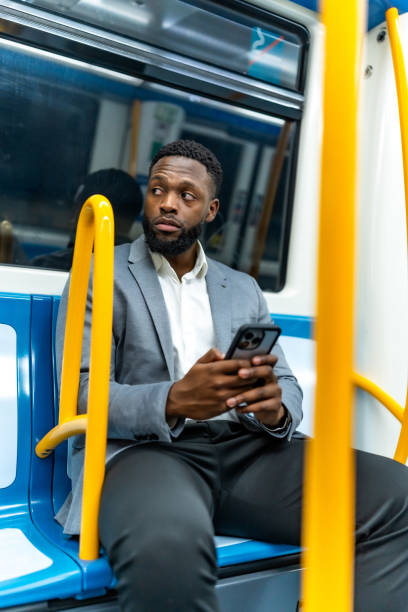 istock Young businessman using smartphone while traveling by metro train 2196157839