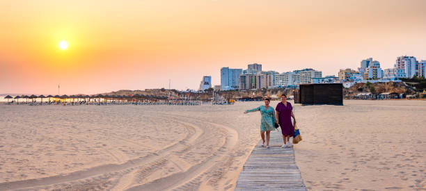 istock Sunset Stroll on Praia da Rocha Boardwalk, Portugal 2196158108