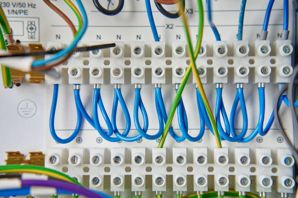 istock Electrical wires connecting to electrical circuit board in distribution box 2196158128