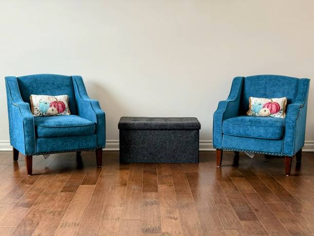 istock Elegant Living Space Featuring Blue Accent Chairs and Wood Flooring 2196158410