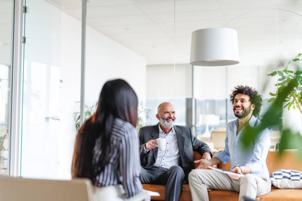 istock Diverse Professionals Engaged in Corporate Meeting 2196159137