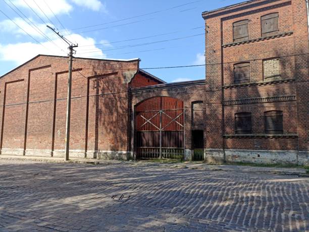 istock An old brick building with many windows covered with wooden shutters Sovetsk 2024 July 17 2196159898