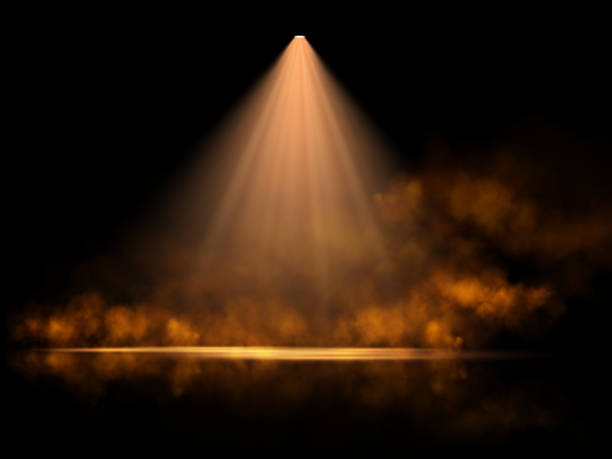 istock A dramatic golden spotlight illuminates a dark stage, surrounded by shimmering particles and a warm, ethereal glow, creating a mystical and elegant atmosphere with subtle reflections. 2196162258