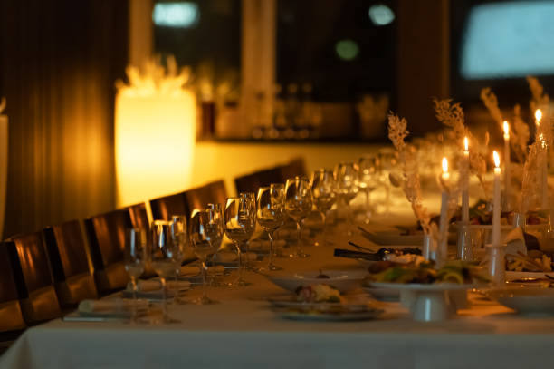 istock Festive dining table, winter holidays, dinner party and celebration concept - close up of Scandinavian Christmas table serving with burning candles at home at night 2196163501
