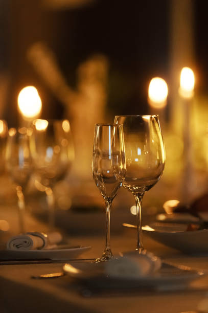 istock Elegant dinner setting with candlelight and sparkling glasses for a romantic evening 2196163535