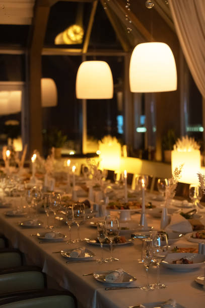 istock Elegant dining setup in a cozy restaurant with warm lighting at evening 2196163549