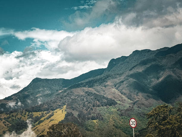 View of hills in Colombia from the roadside during a cloud afternoon