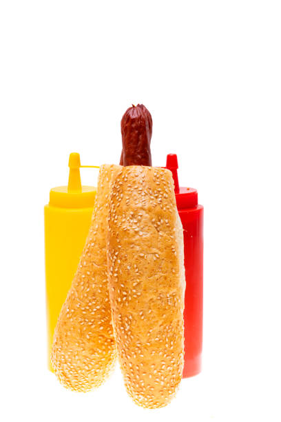 french hot dog with ketchup and mustard on white background