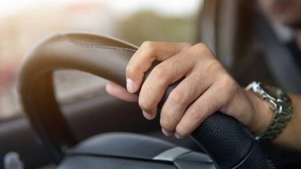 istock Asian man driving a car. 2196165828
