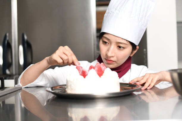 istock Image of a pastry chef making strawberry shorthole cake 2196168017
