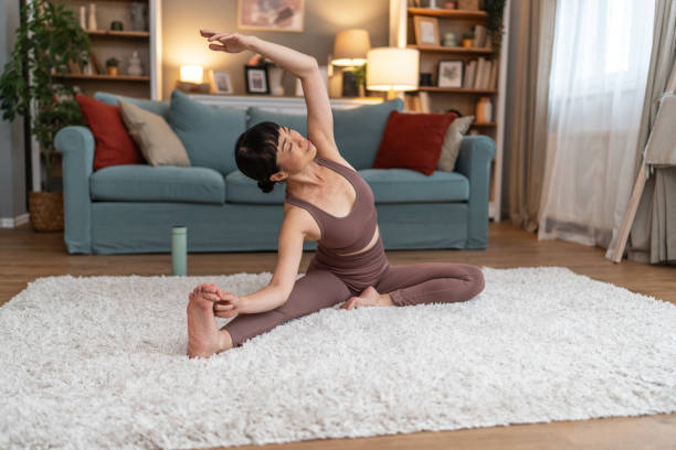 istock Woman doing home workout in living room 2196168228