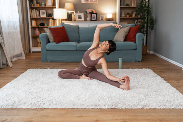 istock Woman doing home workout in living room 2196168271