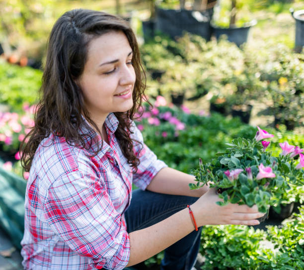 istock florist portrait holding the flowers 2196169452