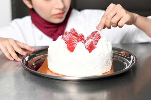 Image of a pastry chef making strawberry shorthole cake