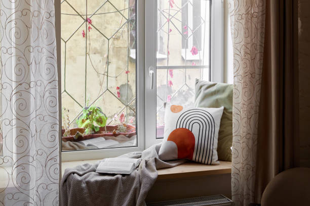 istock A Cozy Window Nook adorned with Beautiful Decorative Pillows and a Soft Throw Blanket 2196170630