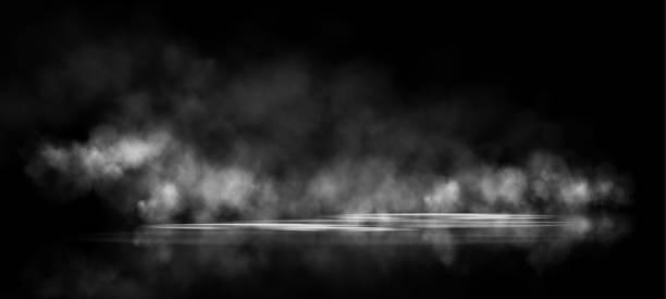 istock A dim spotlight casts soft beams of light through a hazy, fog-like texture against a dark background, evoking a somber and atmospheric mood, ideal for dramatic or abstract visuals. 2196170655