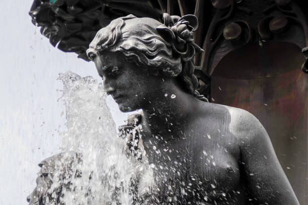Popoli (Italy): water flowing from the mouth of one of the grotesque faces in cast iron on the sides of the Fontana dei Mascheroni (Fountain of the Grotesque Faces), in Piazza della Libertà, the main square of the town of Popoli, in the Pescara province of Abruzzo, in Italy