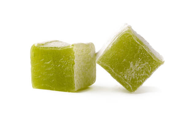 istock Green gelatin cubes on a white background showcasing a unique texture and color with a focus on their transparent appearance 2196173923