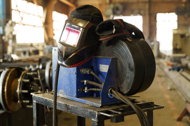Welder man welding a multitubular heat exchanger in boilermaking industry