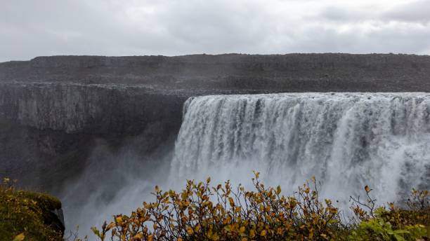 istock Majestic Dettifoss waterfall in Iceland cascading over rugged cliffs under a cloudy sky 2196177099