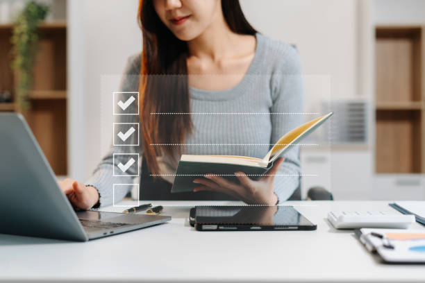 istock Businessman using tablet to do online checklist survey, doing assessment online survey answer test questions Digital form. 2196179582