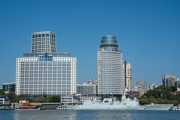 Shanghai, China- May 25, 2015 : A large cargo ship on the Yangtze River and view on Pudong New Area with skyscrapers and office buildings, Shanghai. China