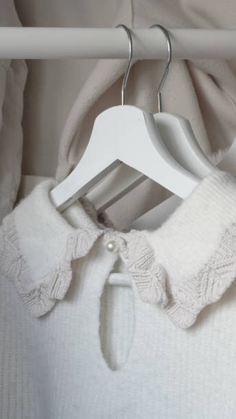 istock Organizing fresh spring wardrobe with vibrant and pastel clothing on racks. 2196184199