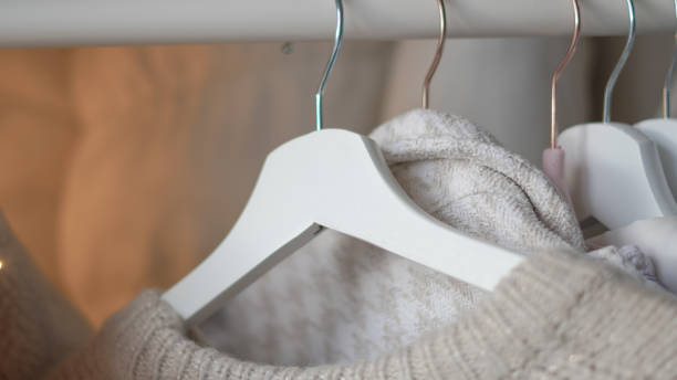 istock Organizing fresh spring wardrobe with vibrant and pastel clothing on racks. 2196184302