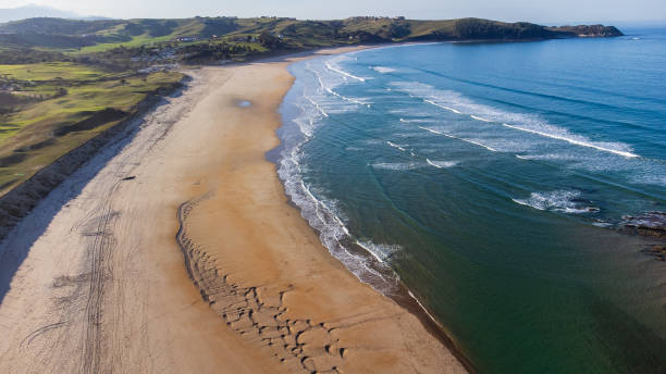 istock Long sandy La Rabia beach, green hills, gentle ocean waves. Cantabria, Spain. 2196186366