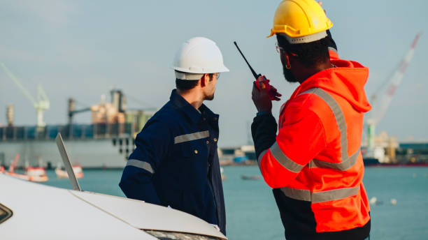istock Multi-ethnic men working at shipping port. 2196189255