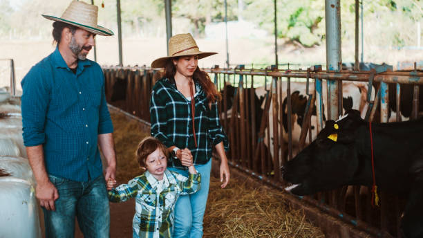istock Happy family in the dairy farm. 2196189711