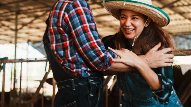 istock Happy couple on a dairy farm. 2196190083