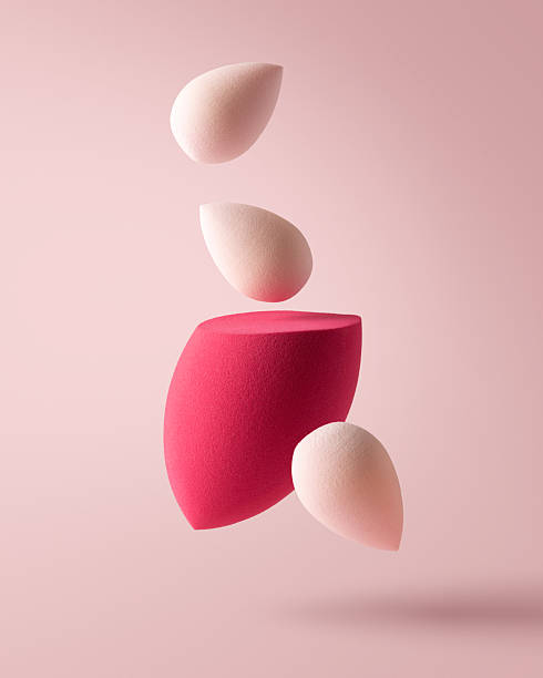 istock Soft makeup sponges in pastel pink tones flying on the air 2196190633
