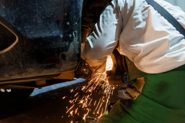 istock A Mechanic Working on a Car Suspension with Sparks Flying 2196192411