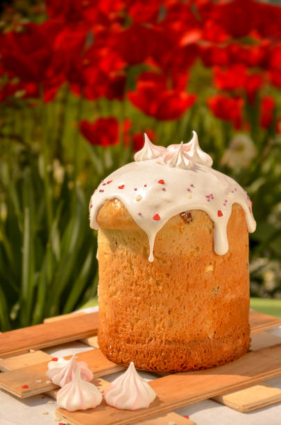 Easter yeast cake sprinkled with powdered sugar, decorated with chocolate eggs. Traditional Easter cake