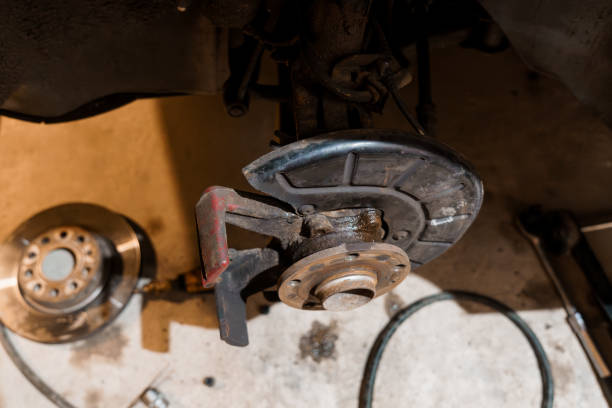 istock Detailed Close-Up of Automotive Brake System Components in a Workshop Setting 2196192961