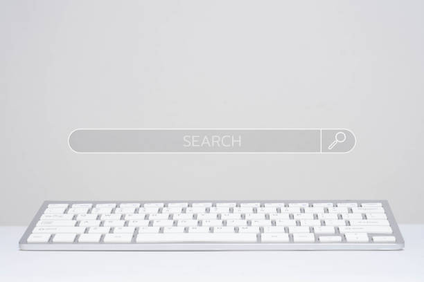 istock Minimalist white keyboard with a search bar imprinted on a blank background, depicting a clean and modern tech workspace concept. 2196196022