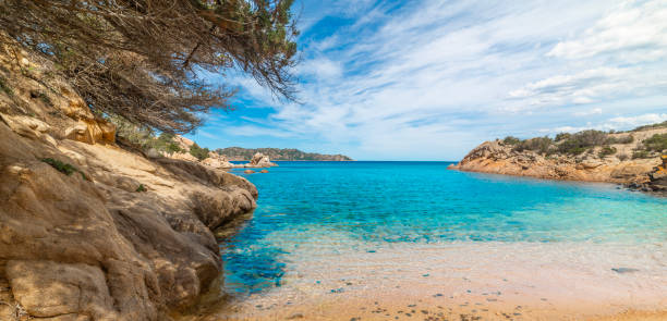 istock Rocks and blue water in a small covw 2196197640