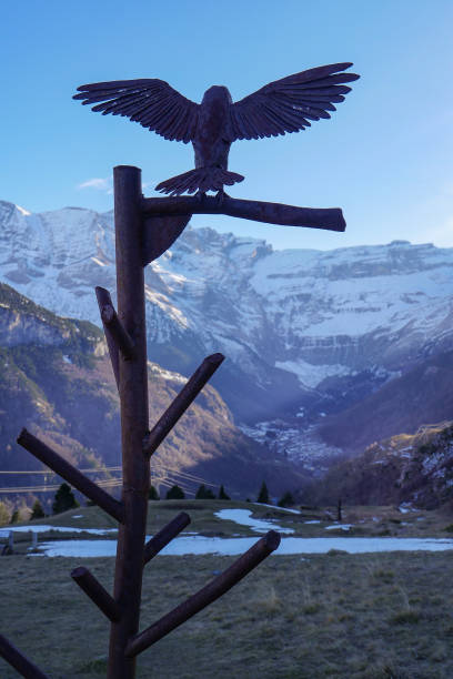 istock Eagle sculpture overlooks majestic mountains in serene landscape during sunset 2196198322