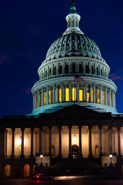 istock United States Capitol Building under a dark sky at sunset 2196198498
