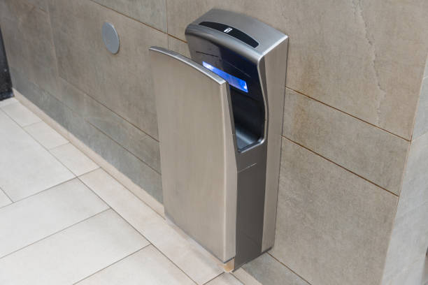 istock This automatic hand dryer is positioned in a sleek bathroom, showcasing modern sanitation technology for efficient drying 2196199102