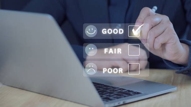 istock Customer points a pen to the check mark box for feedback review opinions from good fair poor choices. Excellent products or services 2196199254